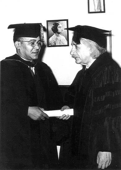 Einstein receives honorary degree from Horace Mann Bond President of Lincoln University. The photo on wall is Marian Anderson.
Courtesy, Langston Hughes Memorial Library at Lincoln University in Pennsylvania
